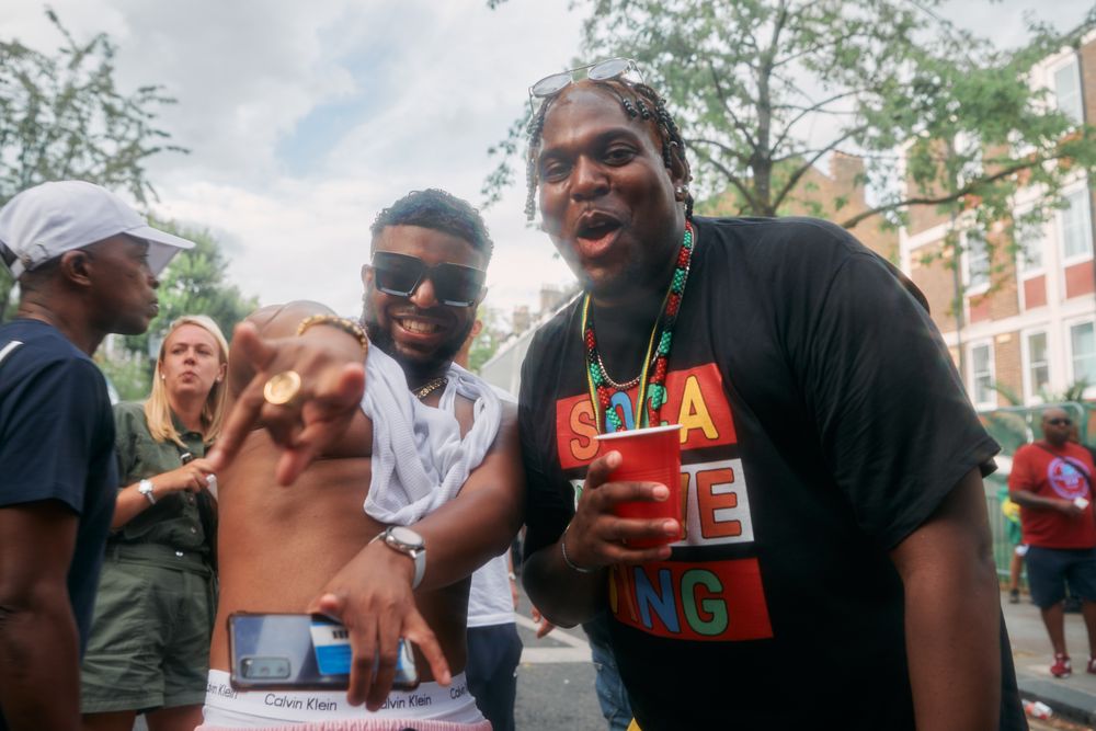 London, England, United Kingdom - August 27, 2022: Two male friends smiling and having fun