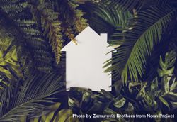 Light-colored home outline against foliage background 4MKMk0