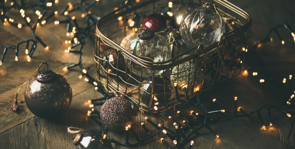 Christmas tree decorations in wire box, with garland, wide composition