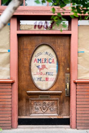 Restaurant door with “God Bless America” sign