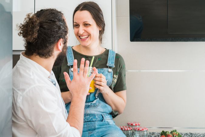Couple eating healthy food in kitchen