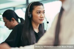 Female operator on the phone in call center bEv3M0