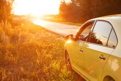 Yellow car on the side of the road