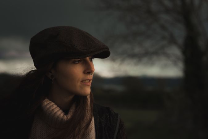 Young woman in warm clothes in forest