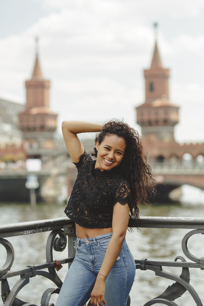 hispanic woman leaning on railing