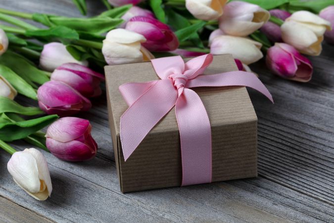 Mother’s Day with the love of tulip and giftbox on aged wood