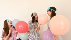 Joyful family celebration with colorful balloons indoors