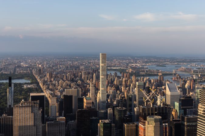 Scenic Aerial New York City View of Manhattan Residential and Office Architecture. Panoramic Evening Sunset Image from a Helicopter. Cityscape with Skyscrapers Near Central Park in Midtown Area