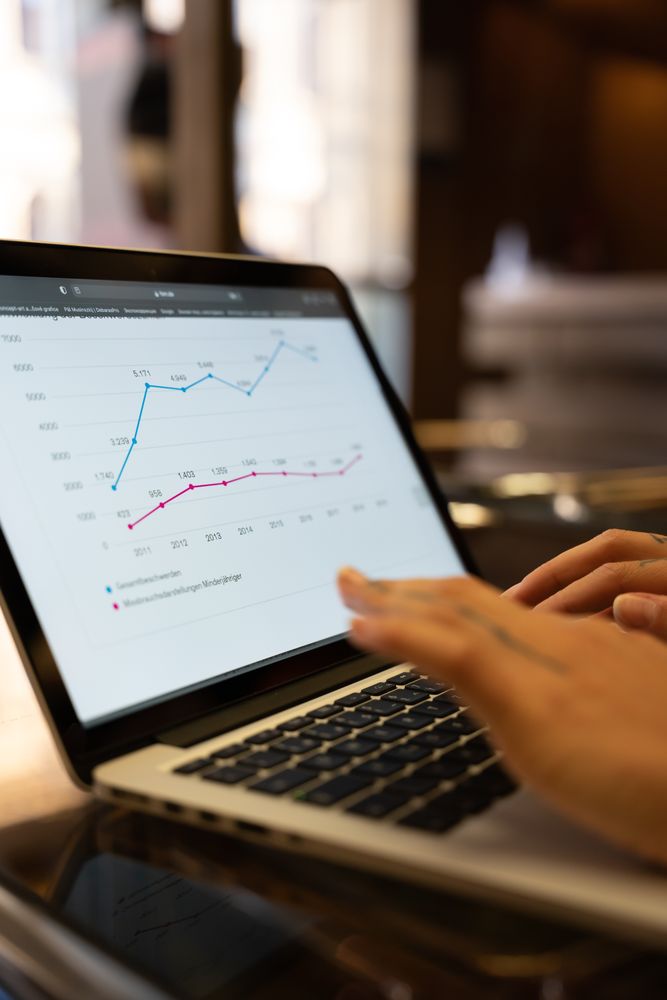 Cropped image of person working on statistics