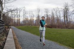 Young female running on a trail.