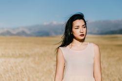 Portrait of female standing in field