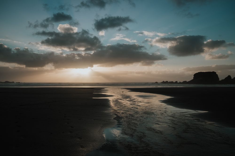Beautiful sunset over sea with cloudy sky
