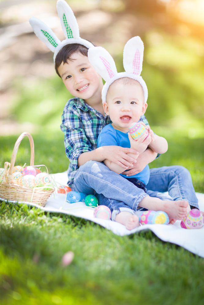 Boys Outside in Park Playing with Easter Eggs