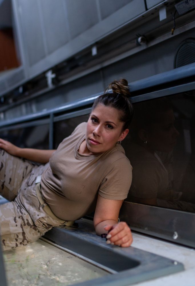 Military woman inside modern vehicle