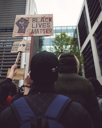 London, England, United Kingdom - June 6th, 2020: Group of people among buildings at BLM protest
