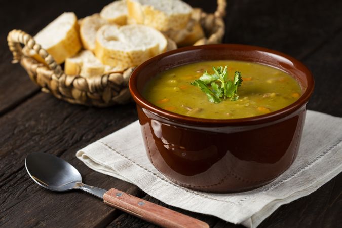 Pea soup. Bowl with pea soup on the table