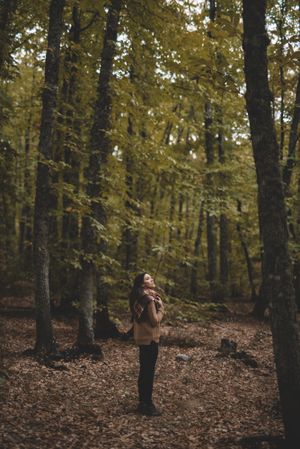 Young female resting in autumn forest