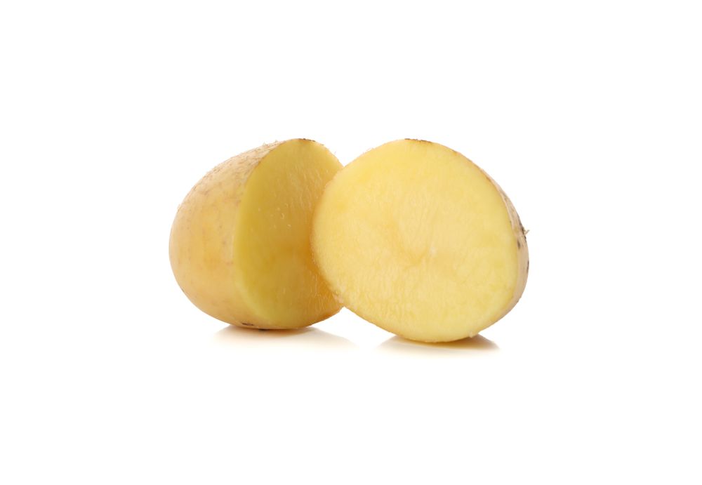 Single potato halved, copy space