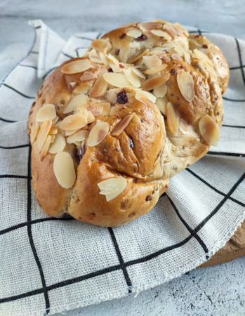 Freshly baked cranberry and cheese bread with almond slices on top
