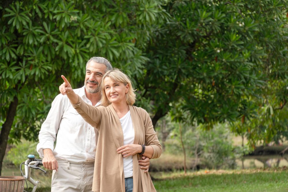 Portrait of happy romantic couple in a green park