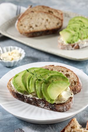 Healthy Homemade Sourdough Bread with Cream Cheese and Sliced Avocado Topping