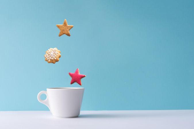 Coffee or hot drink with snowflake and star cookies