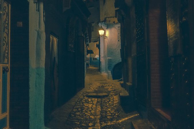 Old narrow street of town at night