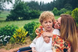 Dissatisfied woman in a wheelchair with her daughter
