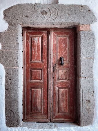 Patmian brown door with hand knocker