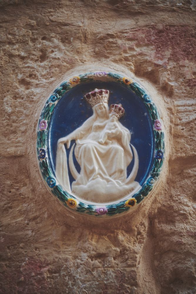Holy mother and child child embedded in stone wall