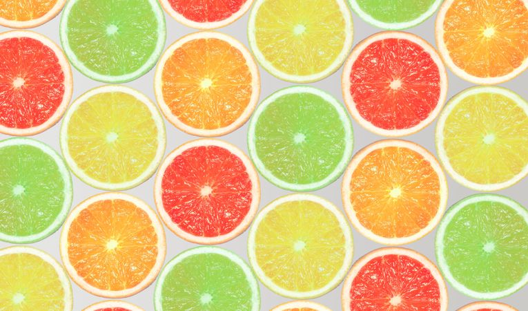 Slices of orange, lemon, grapefruit and lime on bright background