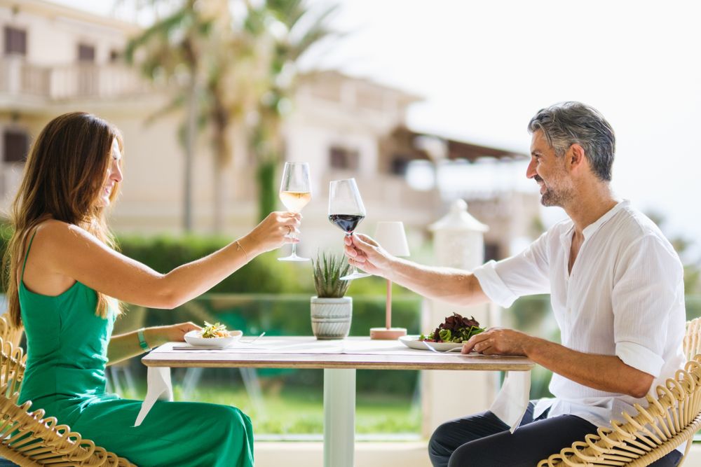 Couple proposing toast in restaurant