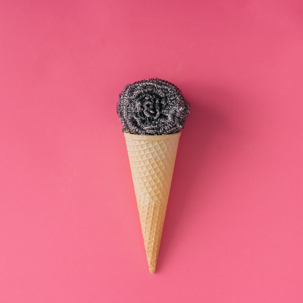 Ice cream cone with steel wool on pink background