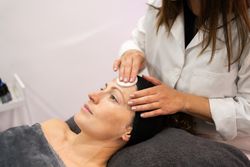 Woman receiving beauty treatment