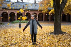 Happy female tourist enjoying autumn in Oslo