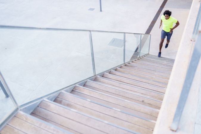 Fit man approaching steps to sprint up