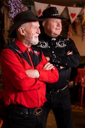 Two mature men in country western attire