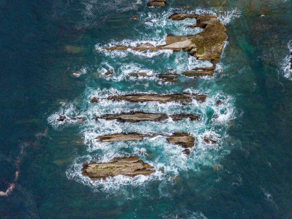 Stone ridges on high seas in stormy day