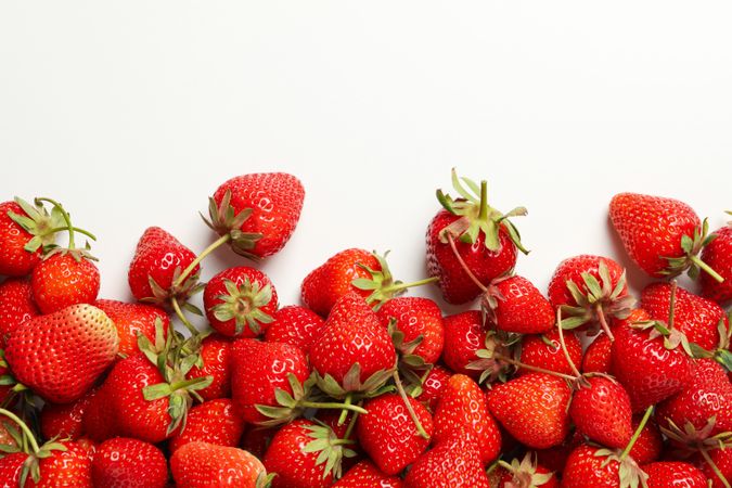 Tasty red strawberry on plain background, space for text. Summer berry
