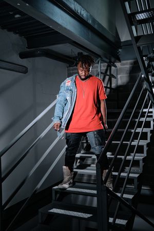 Black male standing on steps
