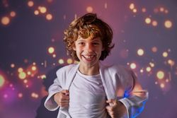 Delighted sportive boy in kimono