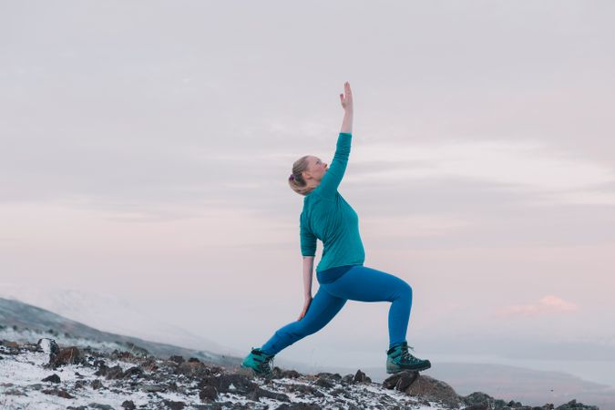 Woman posing on hill in snow