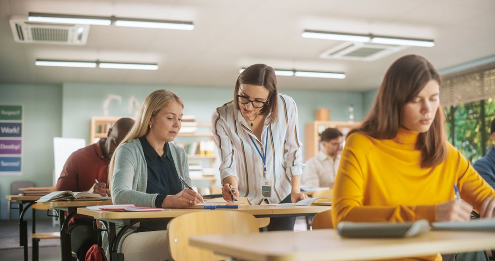 Multiethnic Women and Men of Different Age Acquiring New Academic Skills in Class.