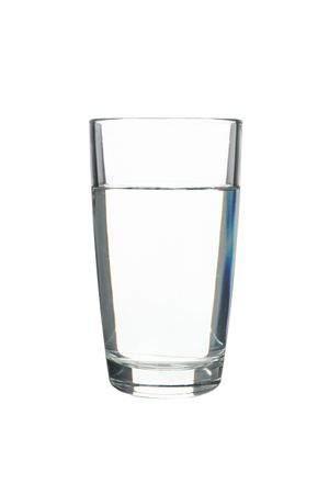 Tall glass of water in plain room