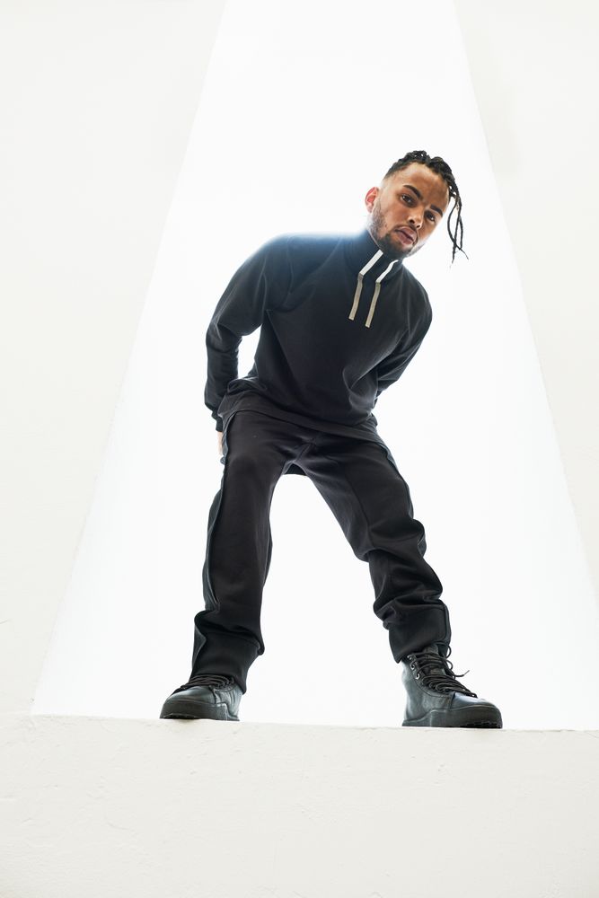 Dancing Black male with braids