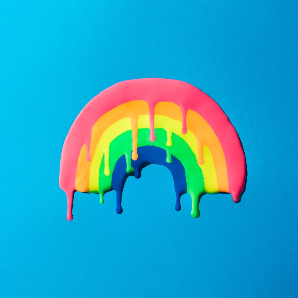 Melting rainbow on blue background