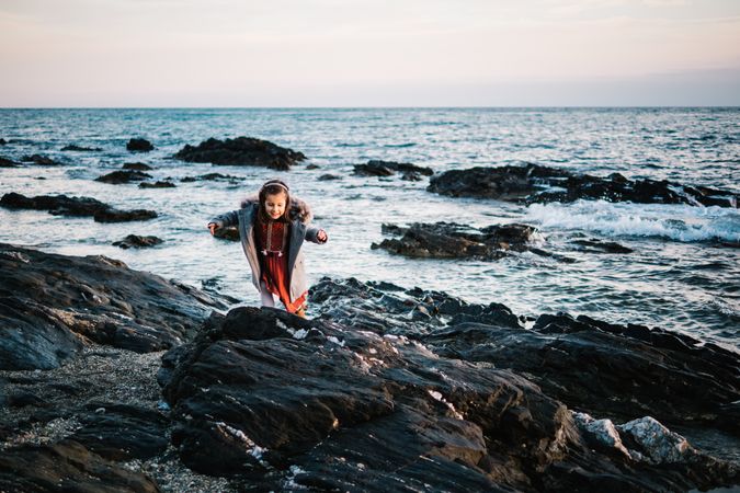 small girl by the beach in winter