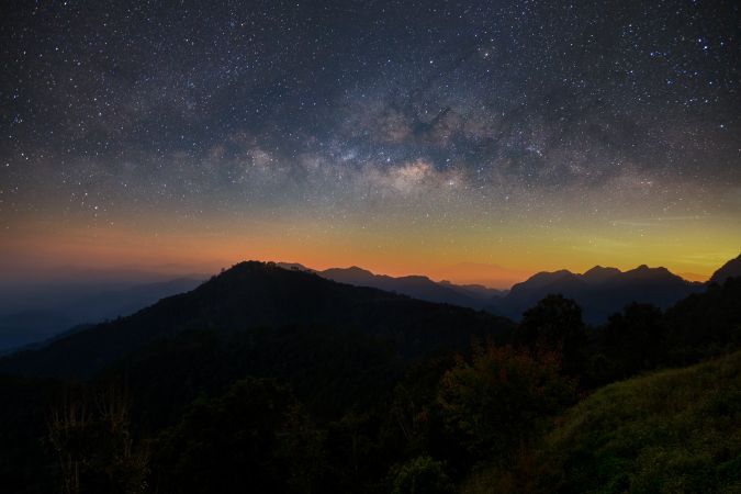 Beautiful mountain landscape with Milky way galaxy at Monson viewpoint Doi AngKhang, Chaingmai Thailand