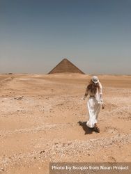 Woman walking toward Pyramid 56ynz0