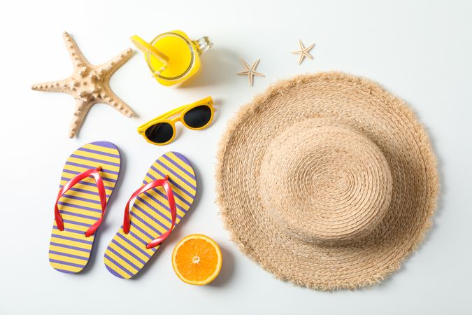 Flat lay composition with summer vacation accessories on plain background, top view. Happy holidays